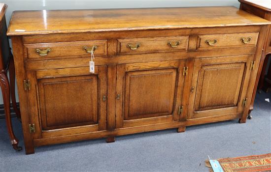 A reproduction 18th century style oak low dresser, W.170cm., D.48cm., H.82cm